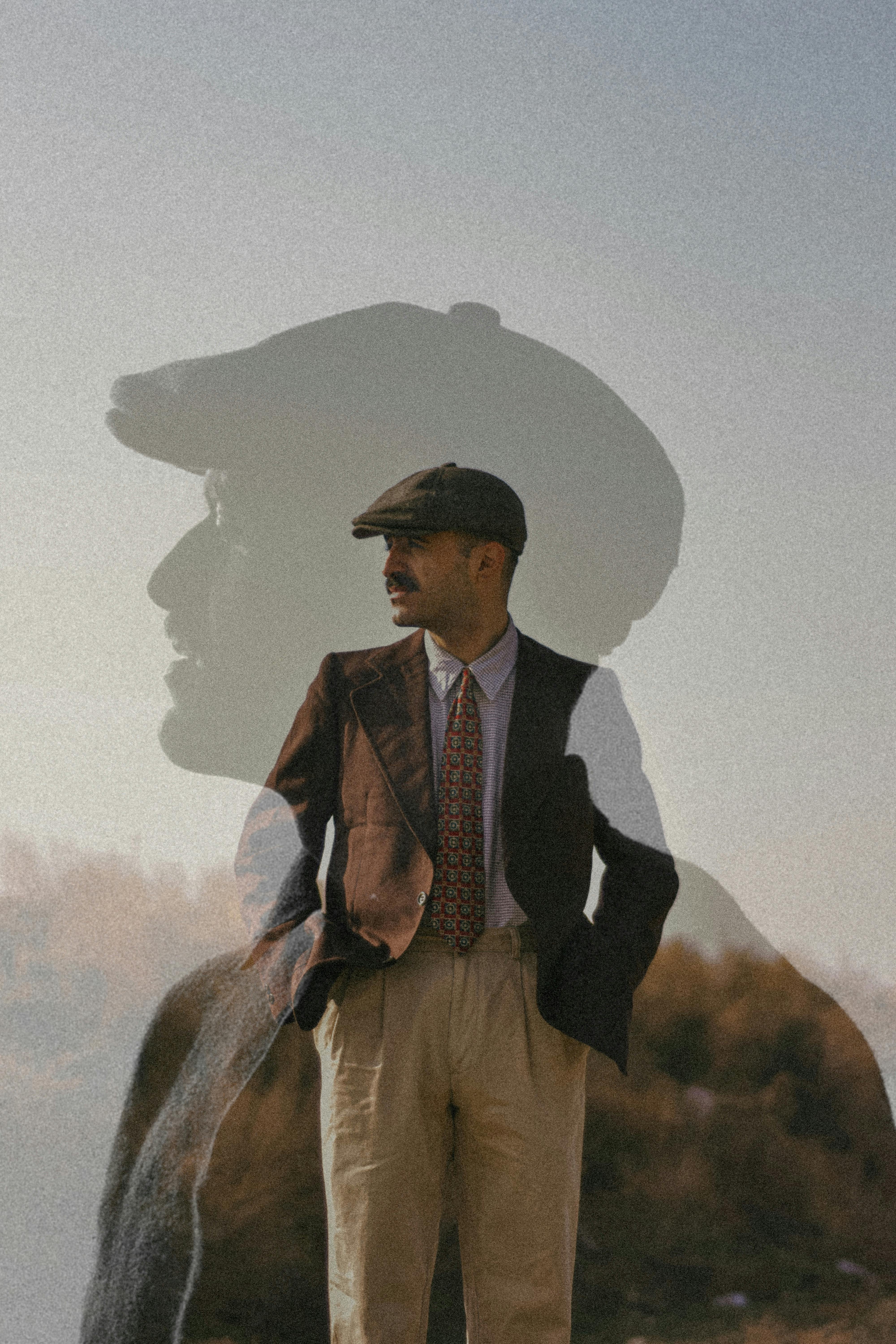 Artistic double exposure portrait of a man in vintage attire, blending style and creativity.