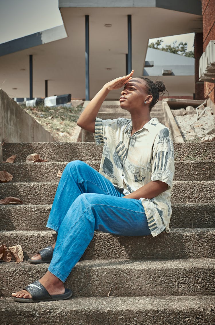 Woman In Shirt Sitting On Stairs