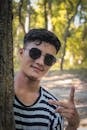Young Man in Sunglasses in the Park
