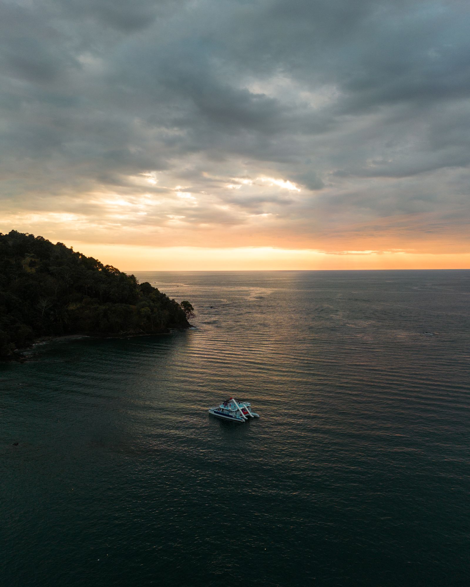 Yacht anchored on the ocean at dusk