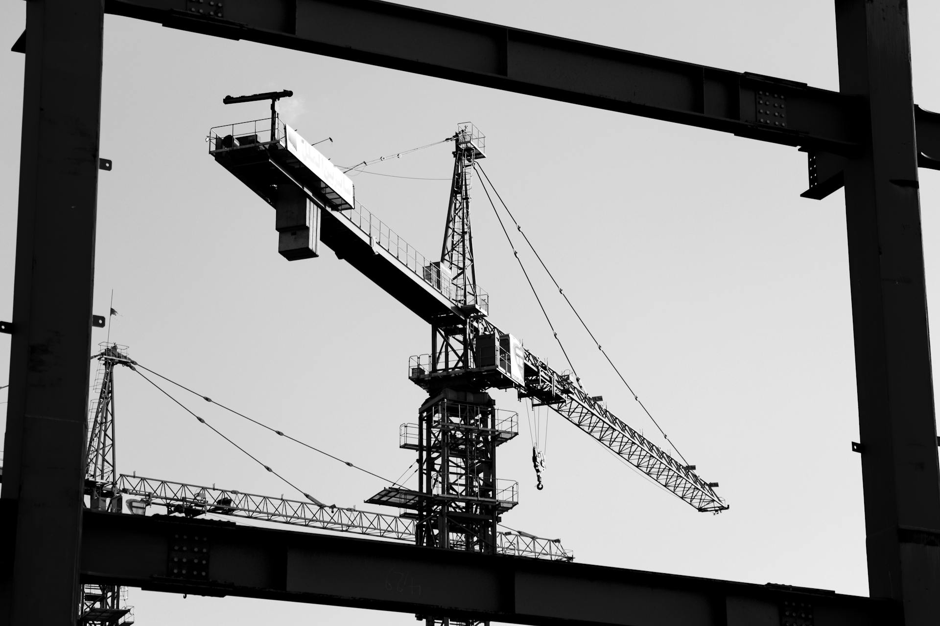 Black and white photo of construction cranes in Tabriz, Iran.