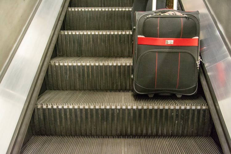 Suitcase On Escalator