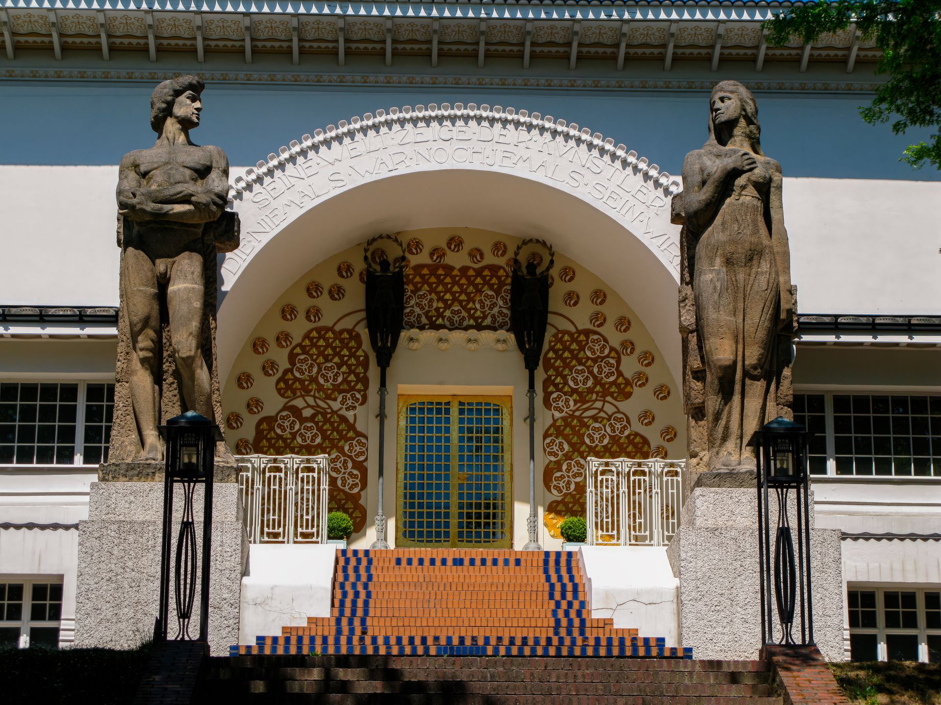 Ornate entrance of Ernst Ludwig House with statues, Darmstadt, Germany.