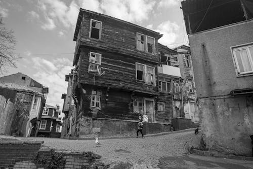 Wooden Buildings by the Street in Black and White 
