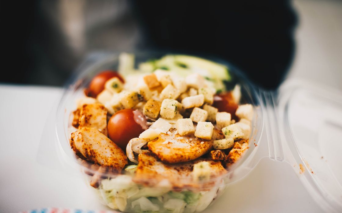 Delicious chicken salad with fresh greens and croutons, perfect for a healthy meal.