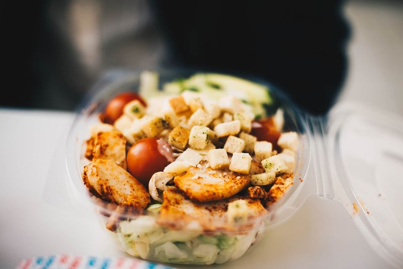 homemade croutons in a small paper bag