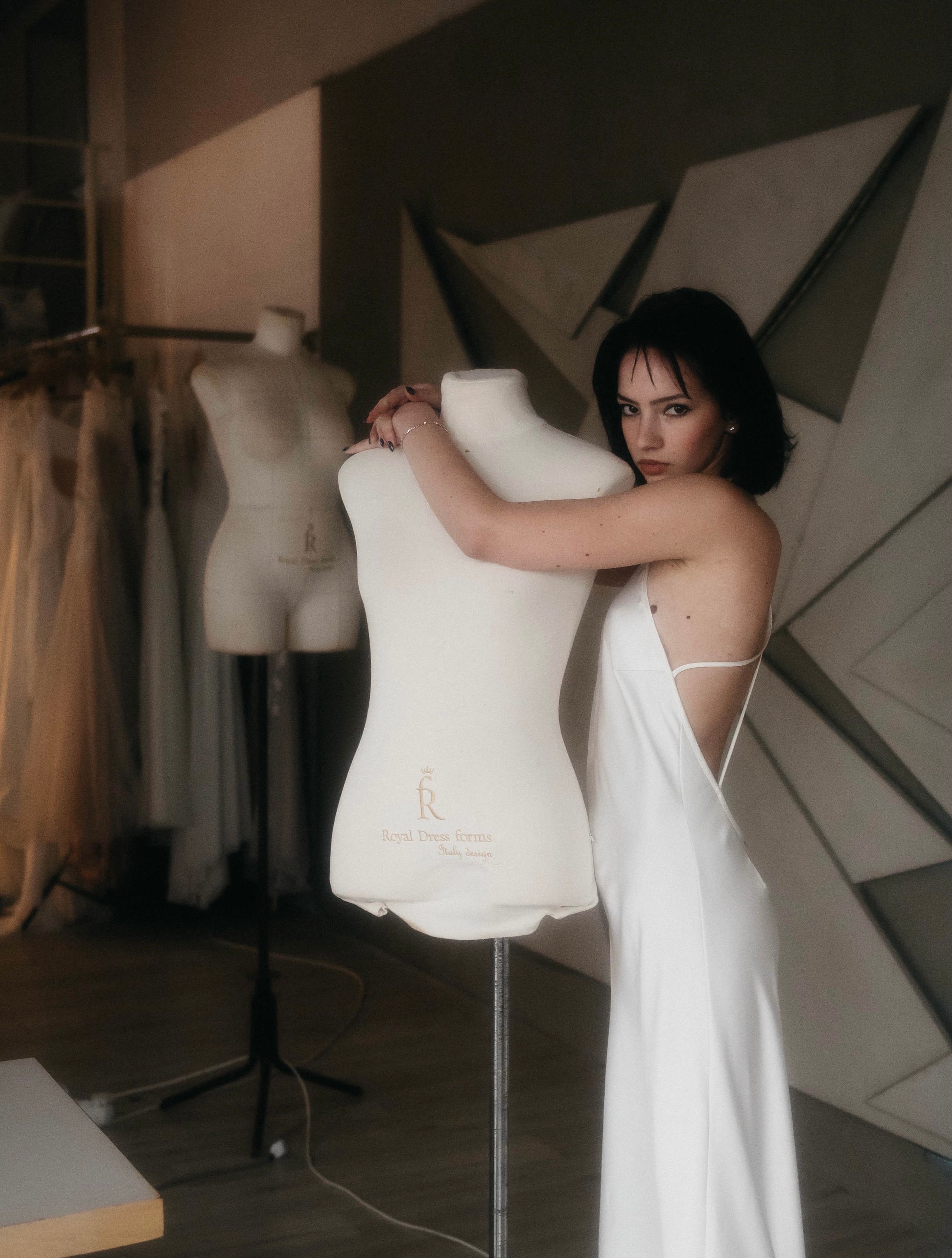 Woman in a White Dress Hugging a Mannequin · Free Stock Photo