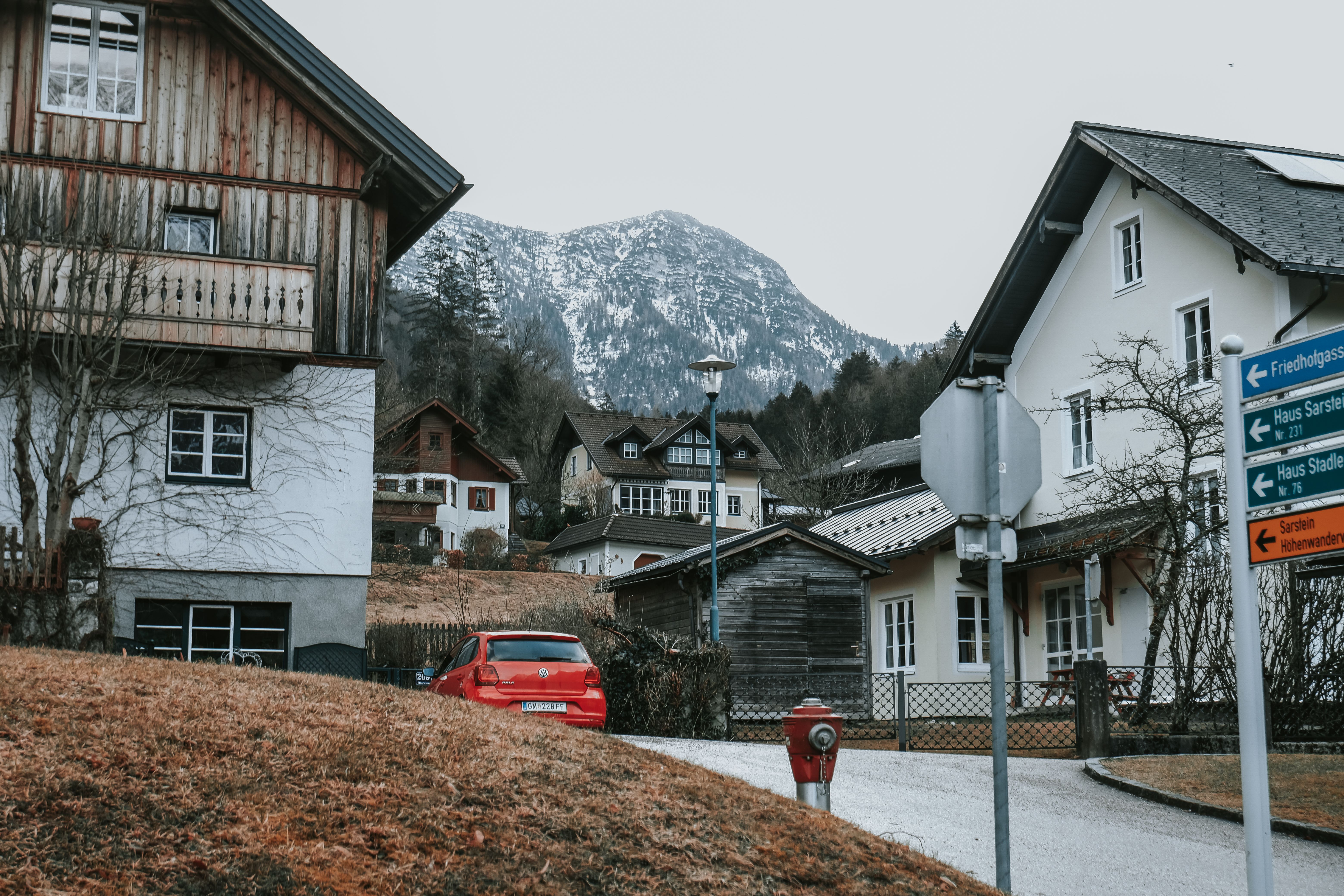 A car is parked in front of a house · Free Stock Photo