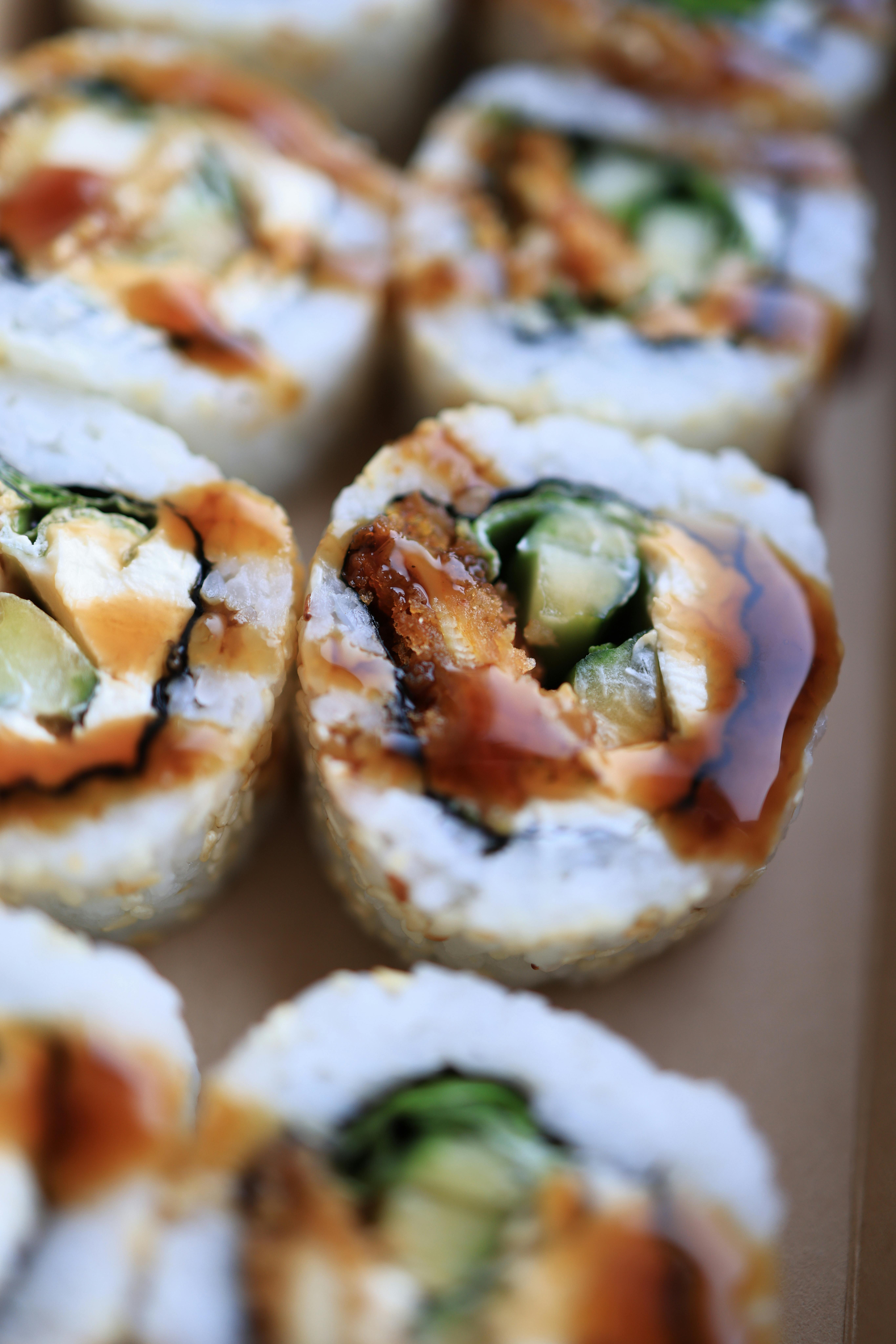 Close-up of Sushi with Soy Sauce on Top · Free Stock Photo