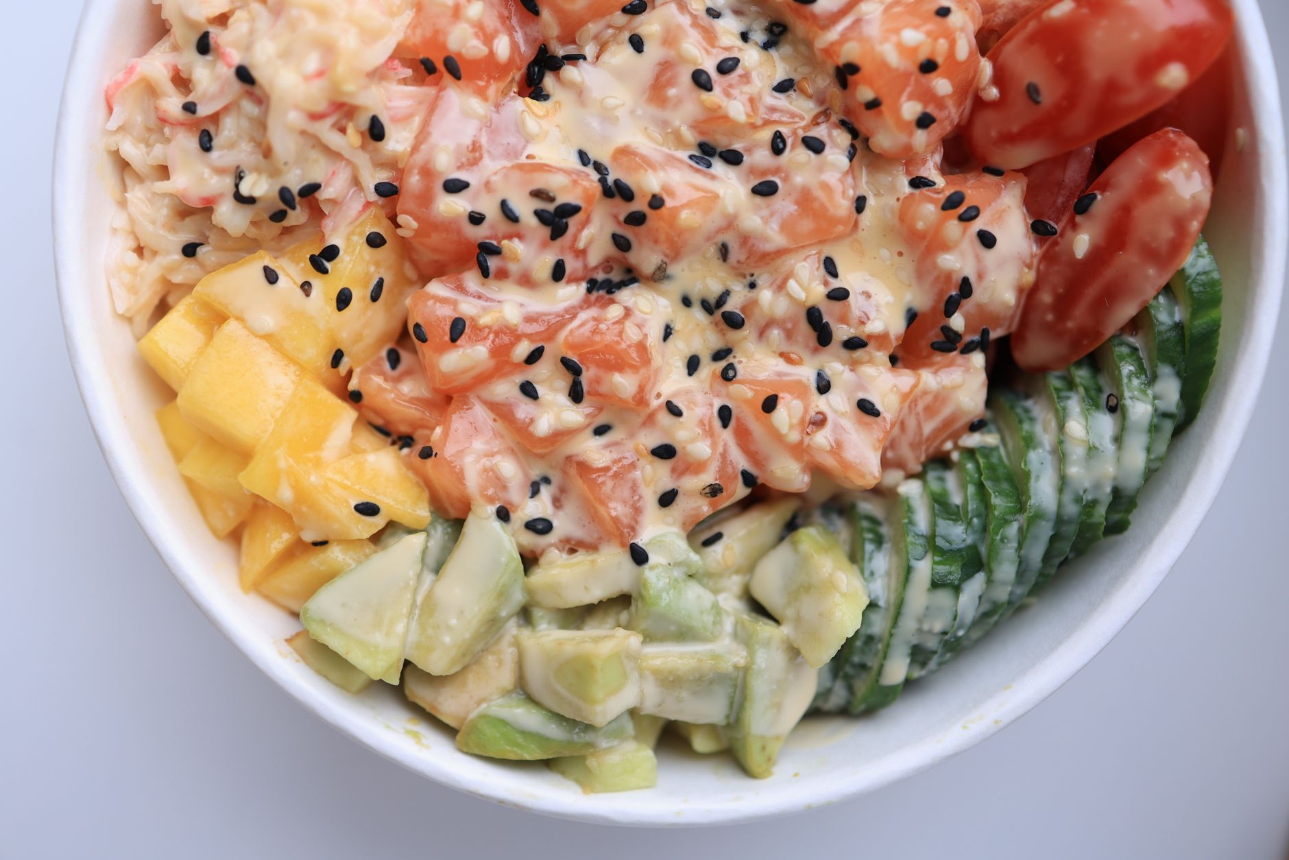 Delicious Dairy-Free Broccoli Salad You’ll Love A vibrant poke bowl featuring salmon, mango, and avocado, perfect for healthy eating.