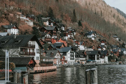 Picturesque view of Hallstatt village by the lake with traditional alpine houses during winter.