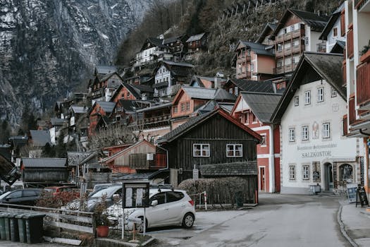 Discover the picturesque and cozy winter atmosphere in the village of Hallstatt, Austria amidst scenic mountain views.
