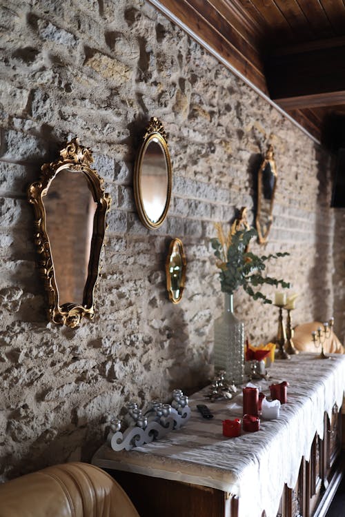 Mirrors Hanging on a Stone Wall in a Vintage Interior