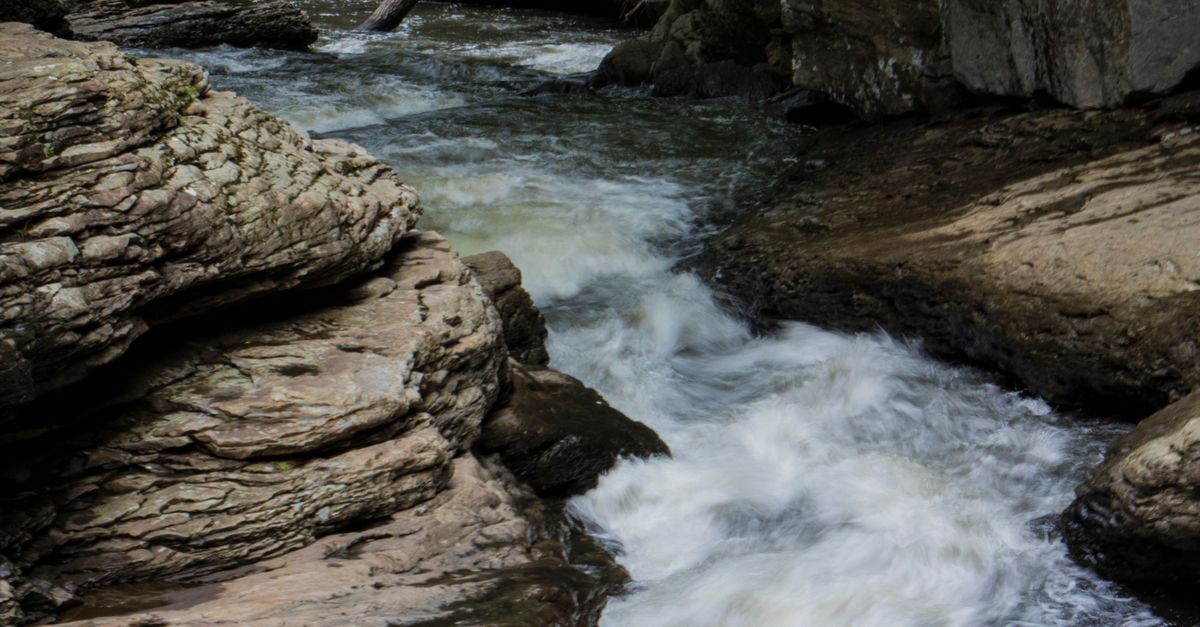 Large Rocks And Stream A Stream Flowing between Large Rocks · Free Stock Photo