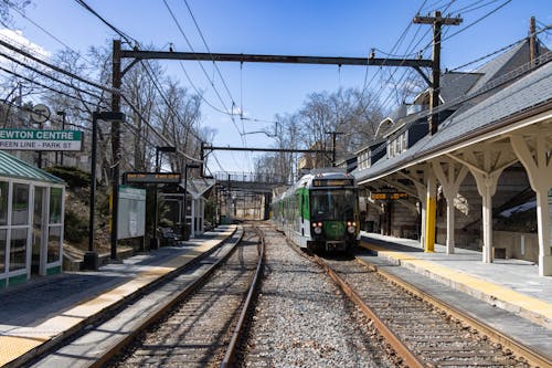 Photo of a Green Train on a Platform