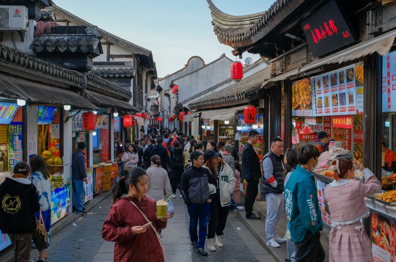 Chinese food market street with traditional architecture and red lanterns