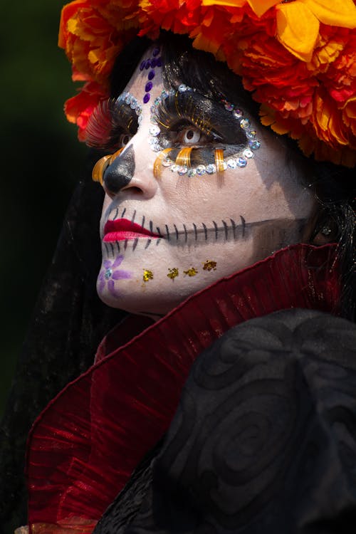 Closeup of a Woman Wearing a Death Festival Mask