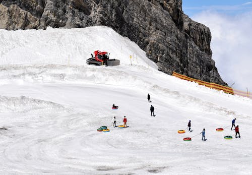 People Having Fun on Ski Slope in Resort