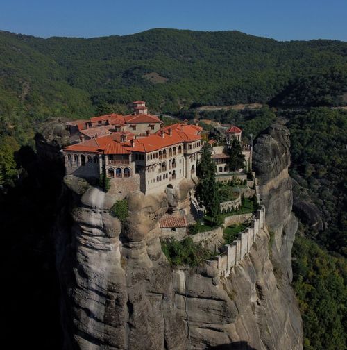 Free Breathtaking aerial view of the historic Meteora monastery nestled atop rocky cliffs in Trikala, Greece. Stock Photo