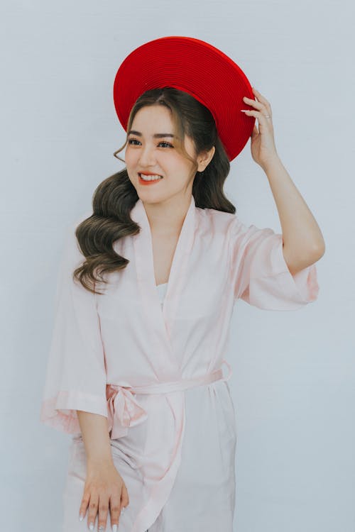 Female Fashion Model Wearing a Red Hat