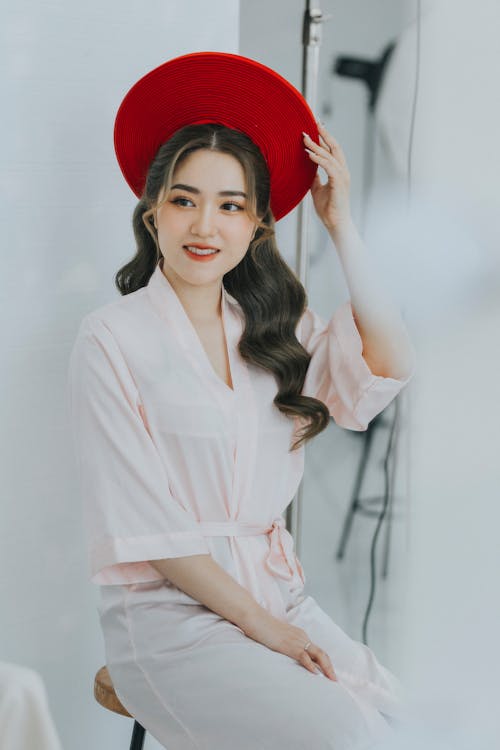 Portrait of a Pretty Brunette Wearing a Red Hat