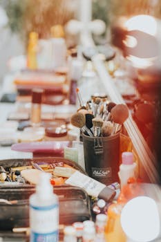 A colorful makeup station filled with brushes and cosmetics in a neatly organized fashion.