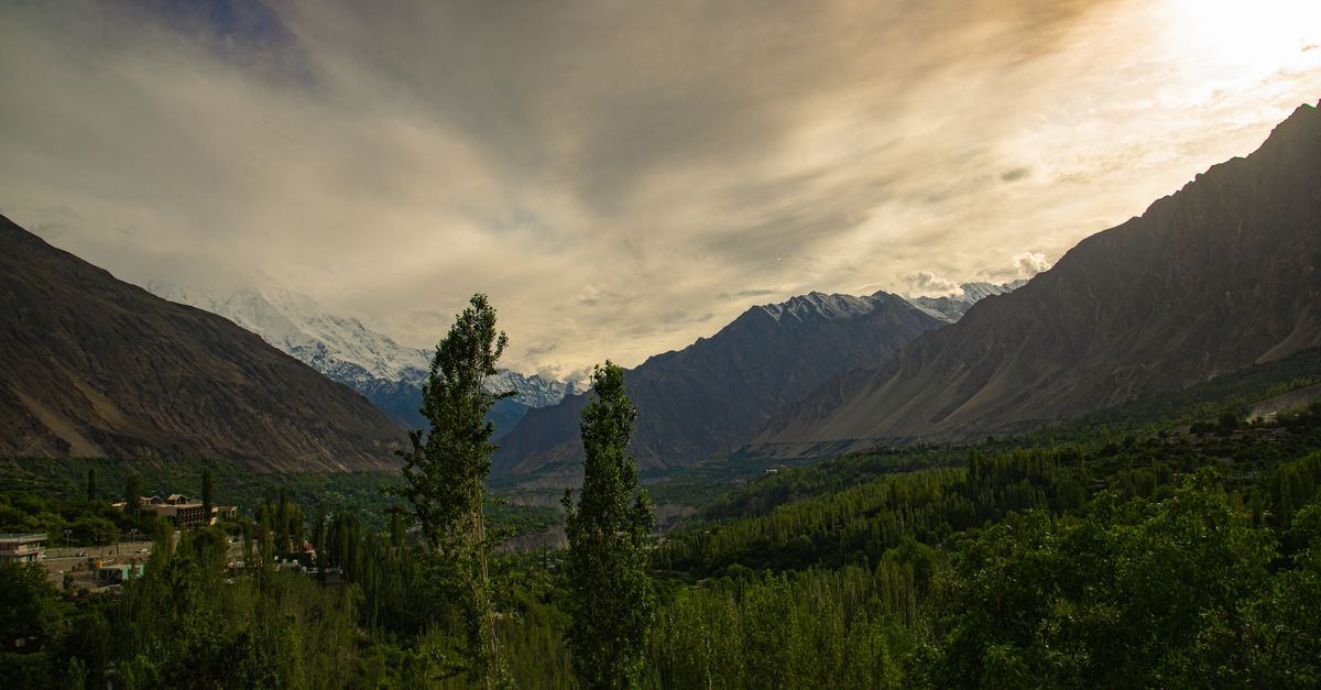 Hunza Valley Pakistan with snow-capped mountains and apricot blossoms