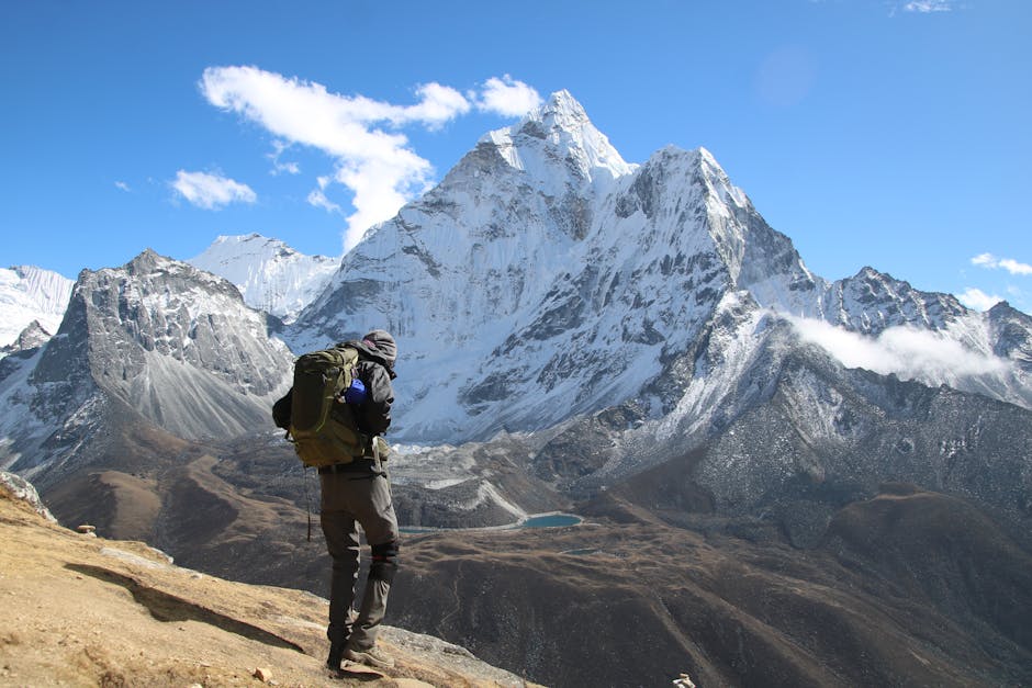 Backpacker exploring the stunning snow-capped mountains in Dingboche, Nepal. in Everest