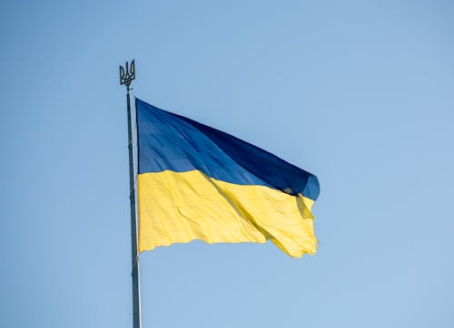 Ukrainian Flag Waving against Blue Sky