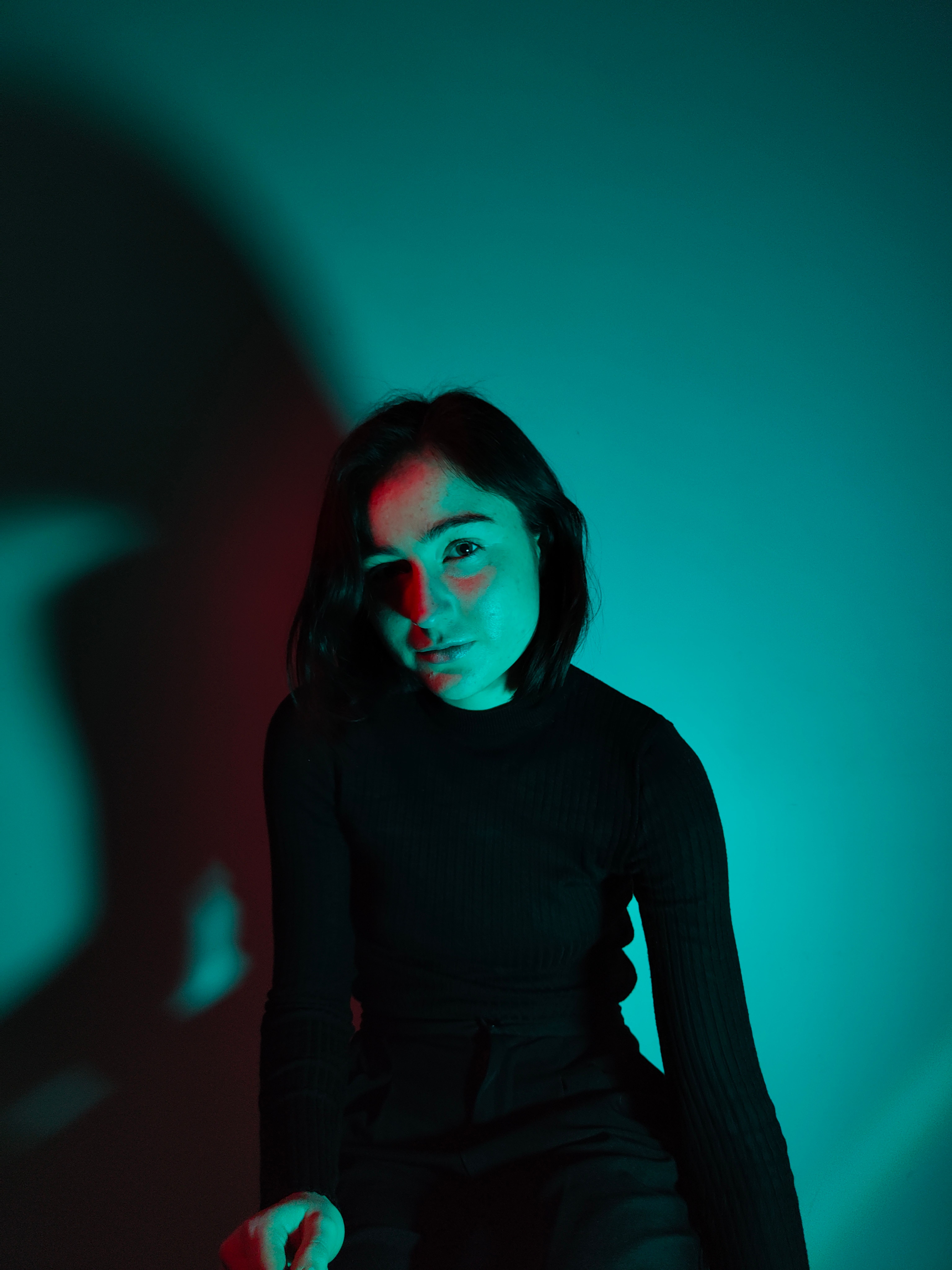 Portrait of a Woman in a Dark Room · Free Stock Photo