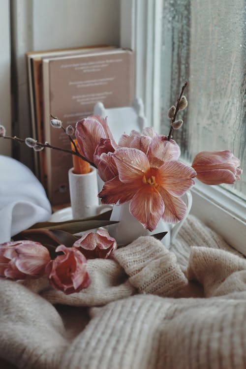 Flowers, Candle, Books and Cloth on Windowsill