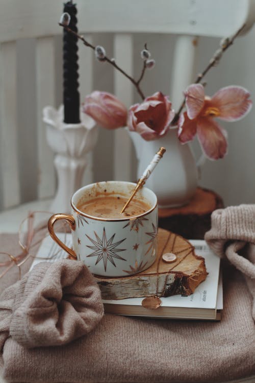 Cup of Coffee on Wooden Coaster