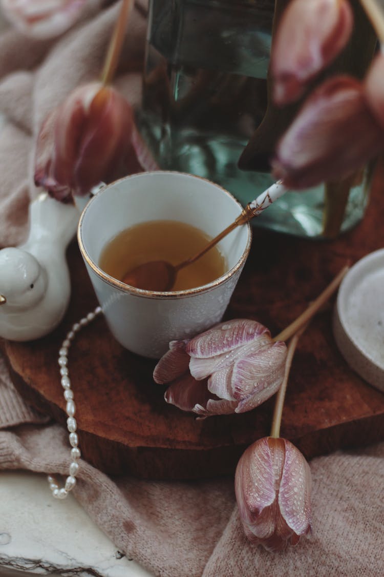 Cup Of Tea And Blooming Tulips