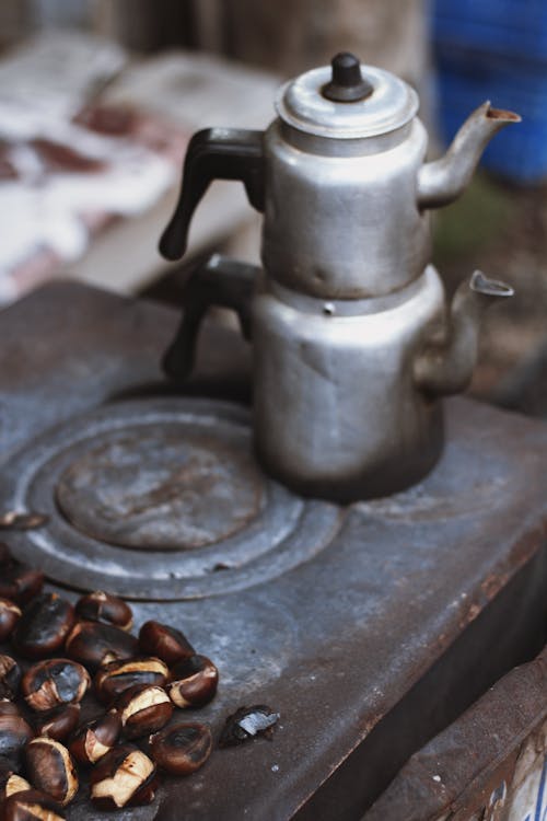 Free Kettles on Old Furnace Stock Photo