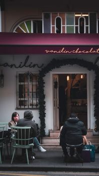 Charming outdoor cafe in Üsküdar with people enjoying a cozy evening.