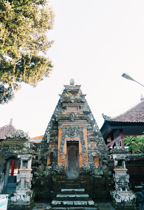 Free Explore ancient Balinese temple ruins surrounded by lush greenery and traditional architecture. Stock Photo