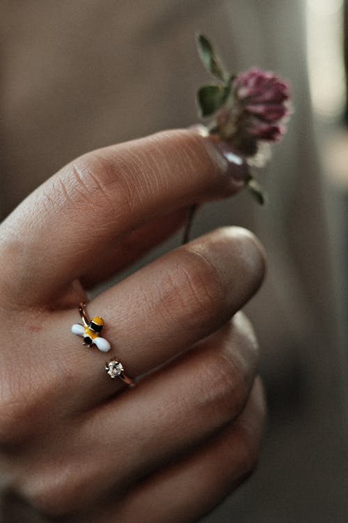 Flower and Ring on Woman Hand