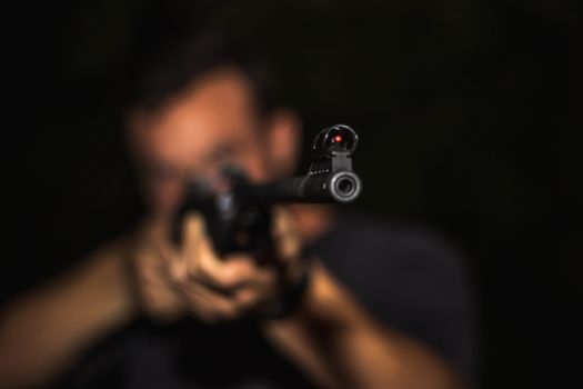 Photo of Man Holding Rifle