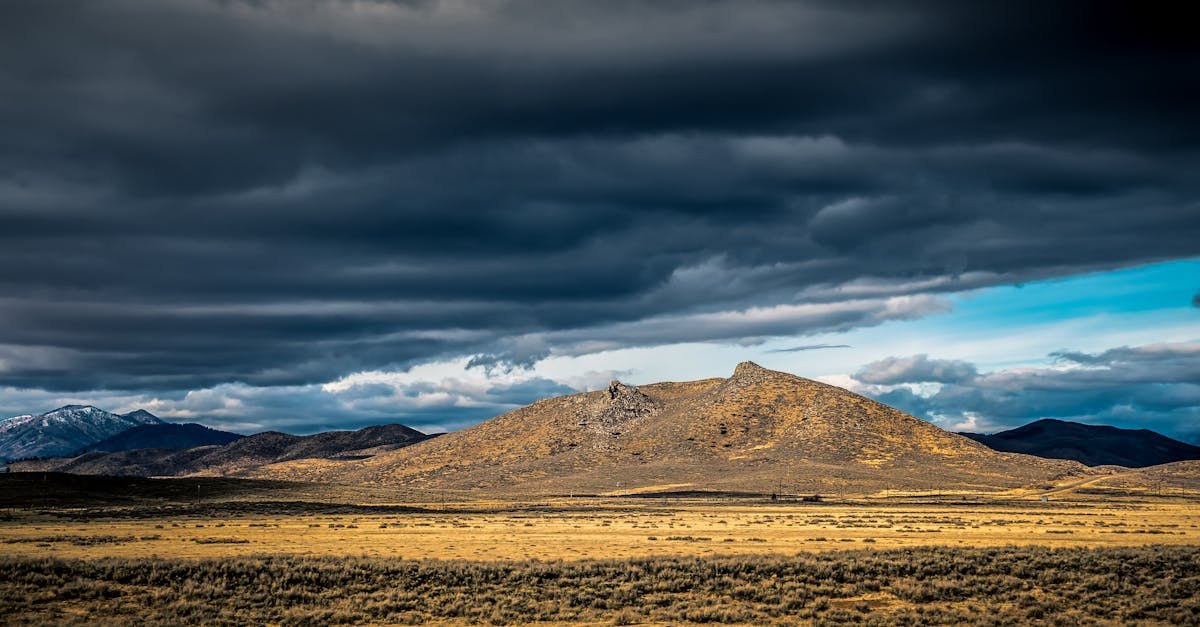 Brown Mountain Under Gray Clouds