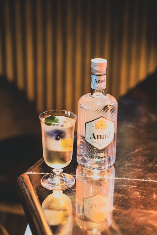 Free A Cocktail and a Gin Bottle Standing on the Table  Stock Photo