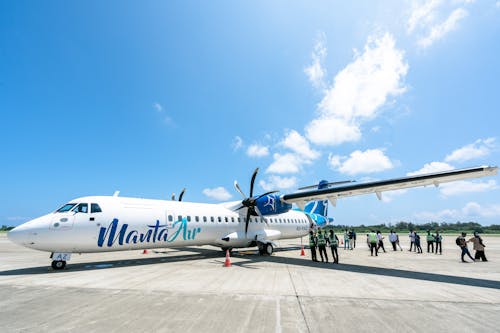 People around Malta Air Airplane