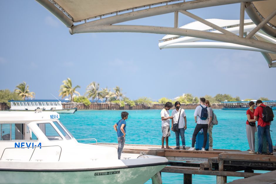 MTCC public ferry approaching a local island in the Maldives, with passengers disembarking