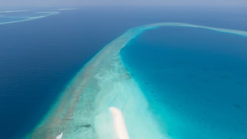 Aerial View of a Peninsula Surrounded by Blue Sea