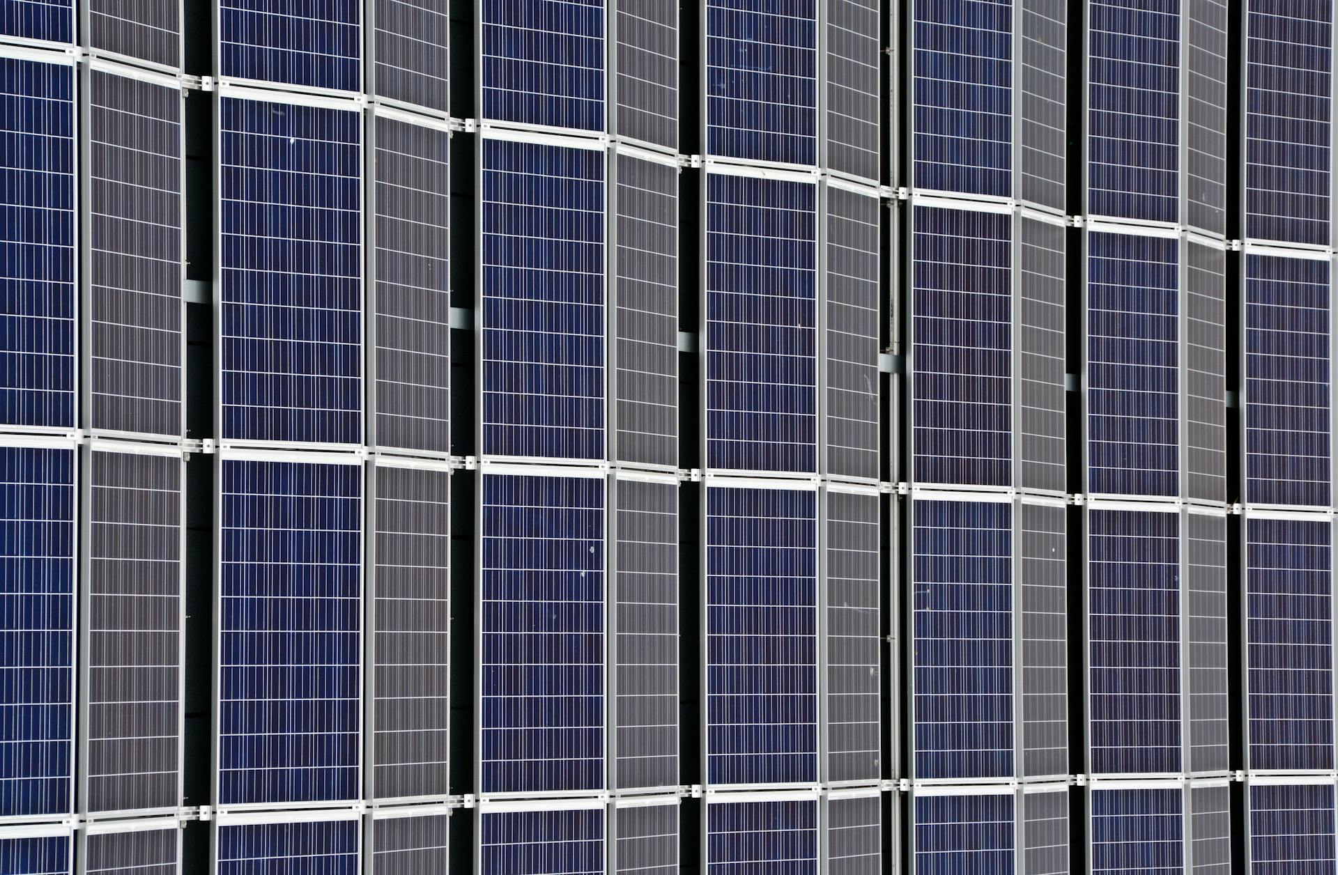 Close-up of multiple solar panels representing renewable energy and sustainability.