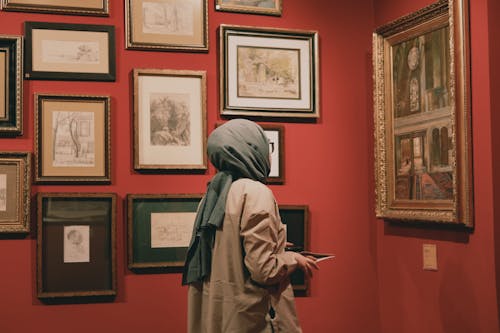Woman Looking at Paintings in an Art Museum 