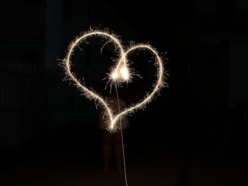 Performer Creating Heart Shape with Sparkler