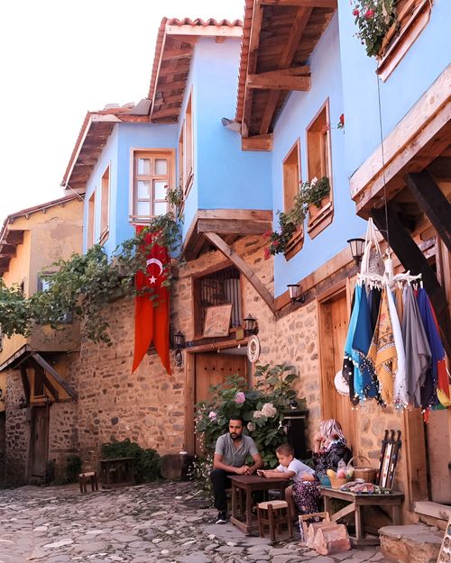 Free A family enjoys a day in a historic village with colorful architecture in Bursa, Türkiye. Stock Photo