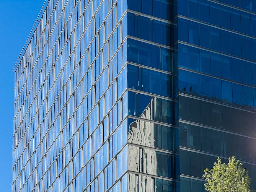 Sleek glass and steel skyscraper in a modern city - architectural styles modern Sleek glass and steel skyscraper in a modern city - architectural styles modern