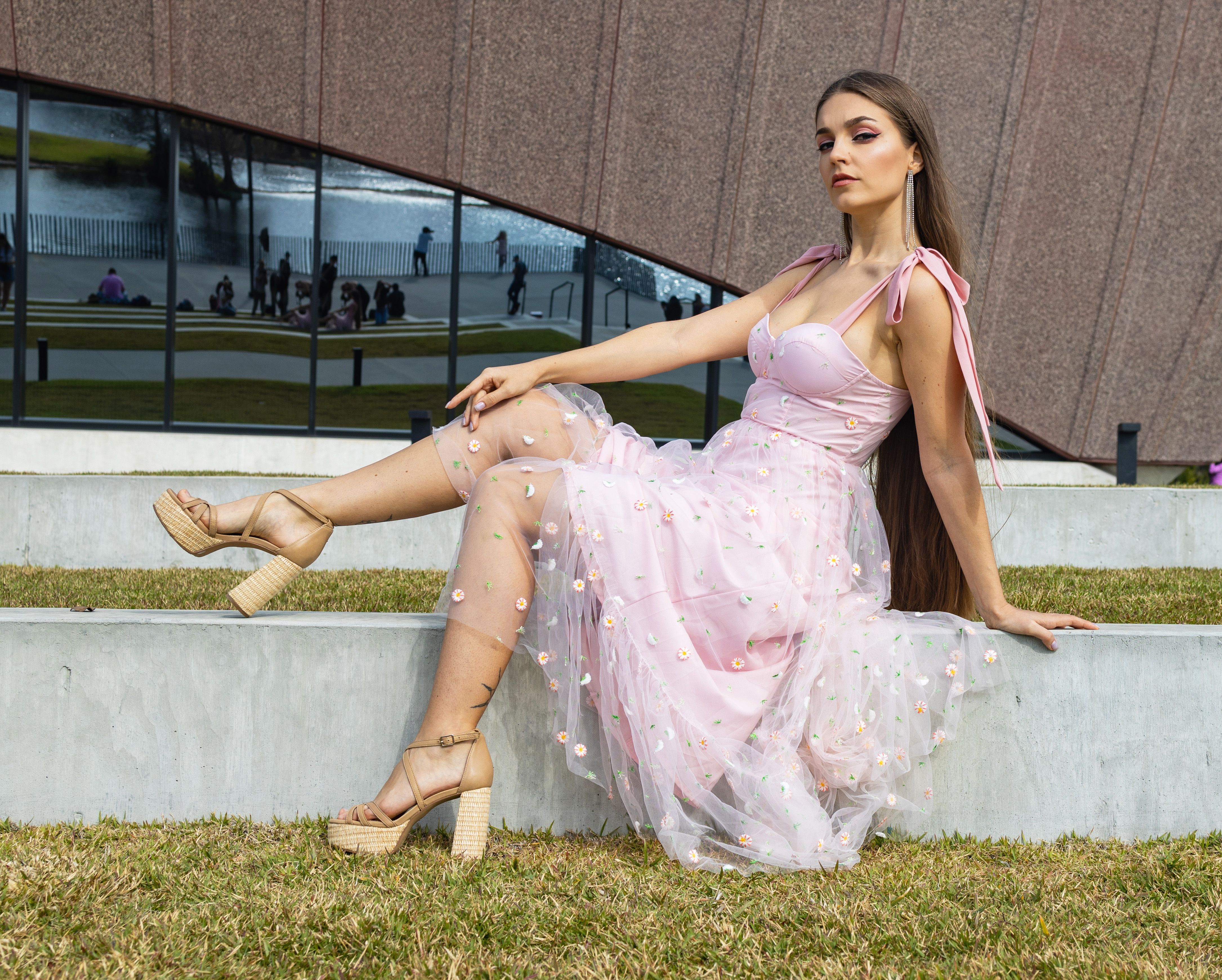 Female Model Wearing a Pink Dress and Platform Heels Posing Outdoors ...