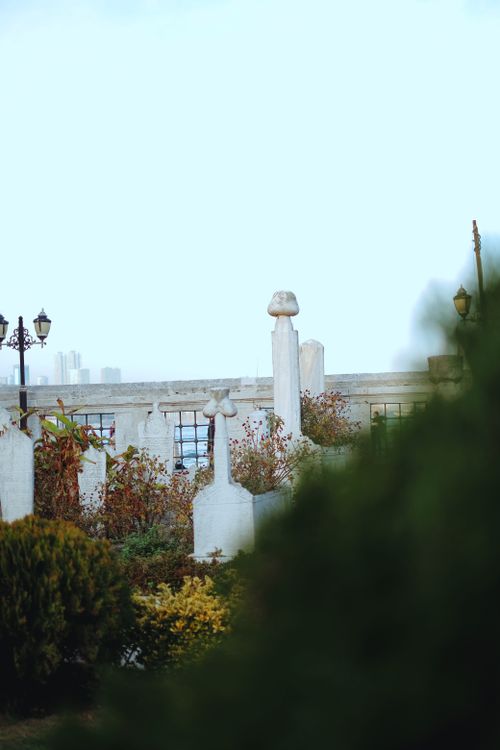 Free A beautifully designed garden with elegant topiary and historical monuments, showcasing classic architecture. Stock Photo